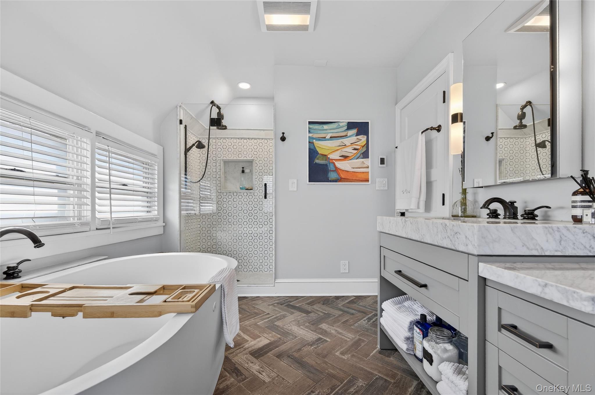 3 Beacon Hill Road Port Washington, NY 11050 - Photo 24 of 43 a bathroom with a tub sink and mirror