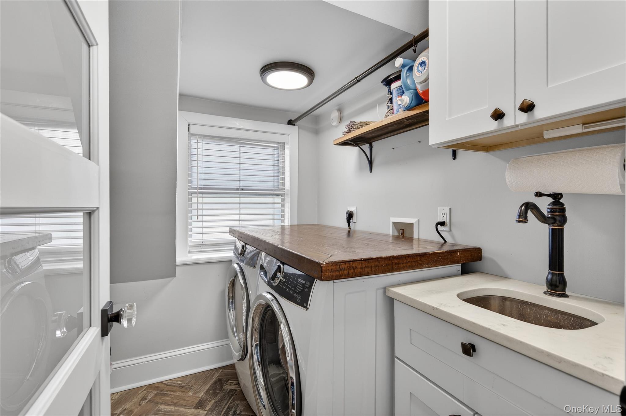 3 Beacon Hill Road Port Washington, NY 11050 - Photo 25 of 43 a kitchen with stainless steel appliances granite countertop a sink and cabinets