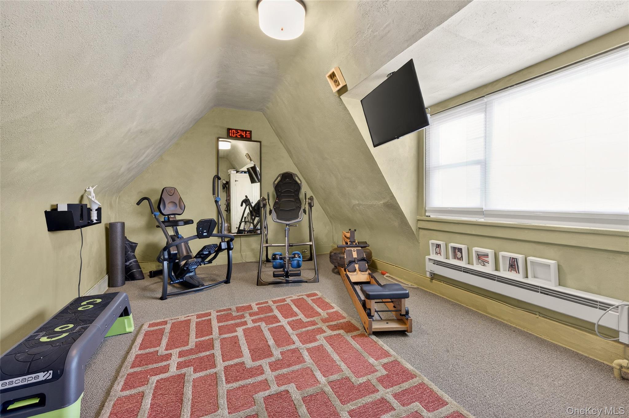 3 Beacon Hill Road Port Washington, NY 11050 - Photo 27 of 43 a bedroom with furniture and a window