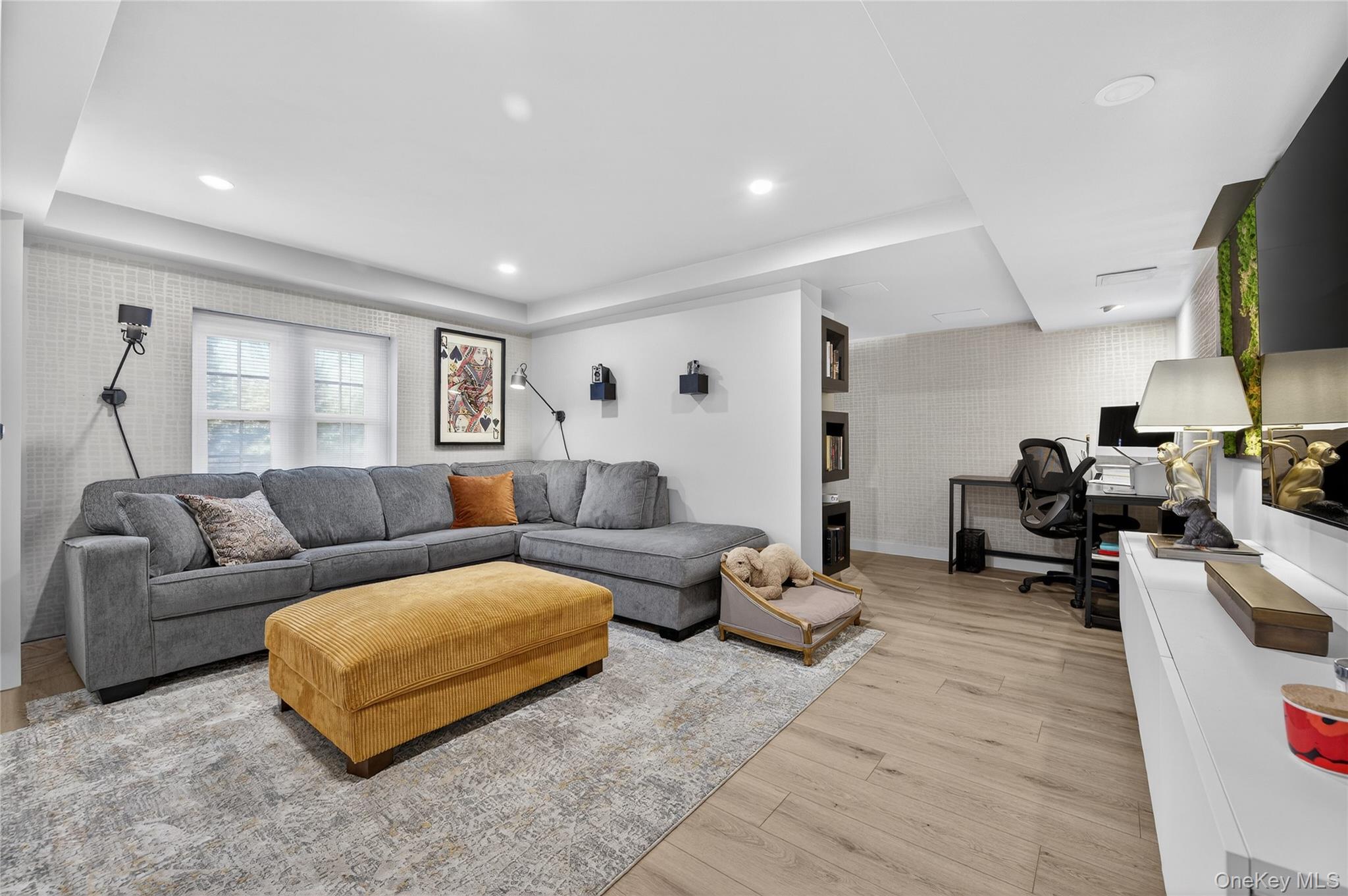 3 Beacon Hill Road Port Washington, NY 11050 - Photo 28 of 43 a living room with furniture and a flat screen tv