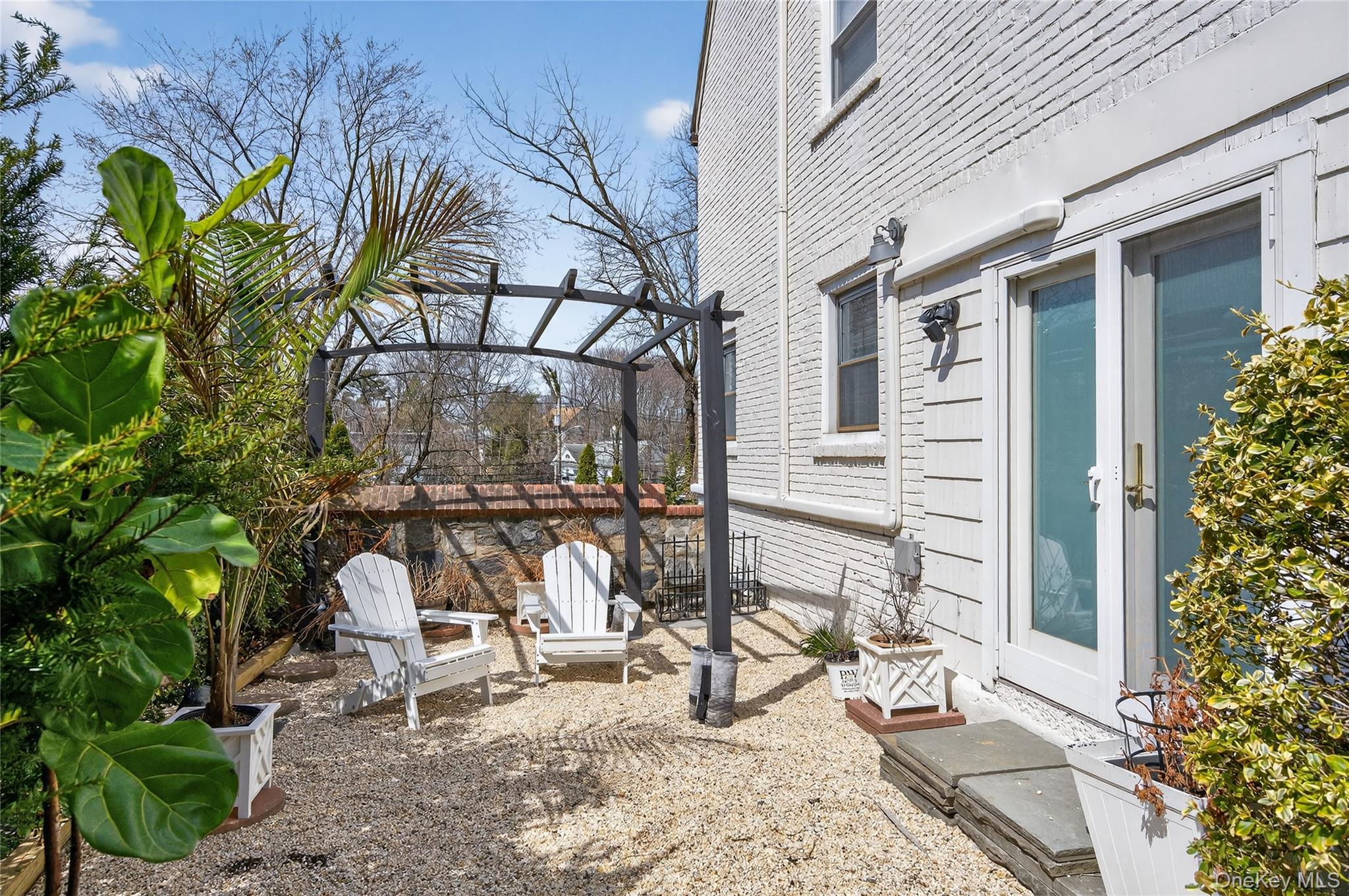 3 Beacon Hill Road Port Washington, NY 11050 - Photo 32 of 43 a view of a lounge chairs in the porch