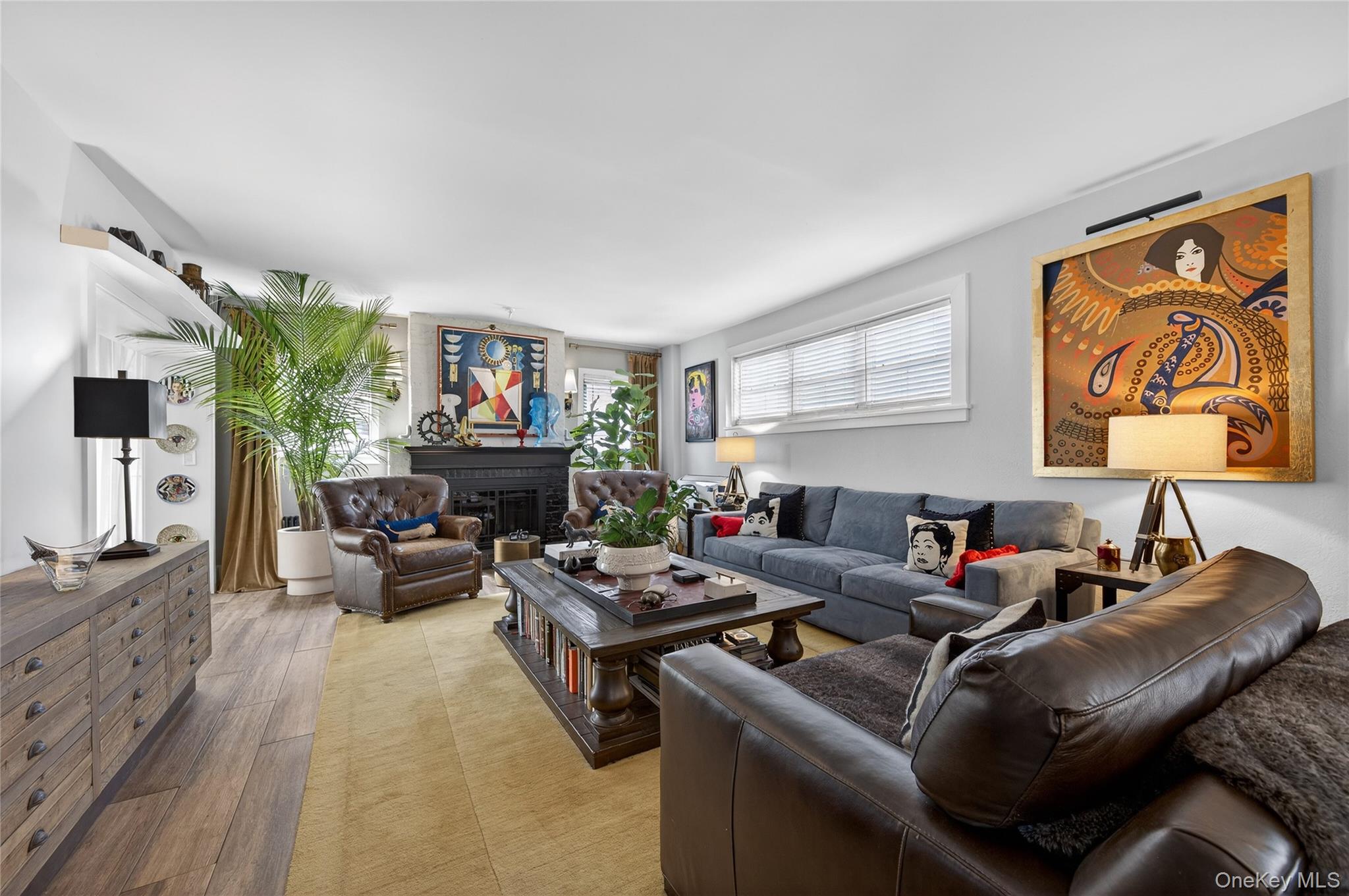 3 Beacon Hill Road Port Washington, NY 11050 - Photo 7 of 43 a living room with furniture and a fireplace