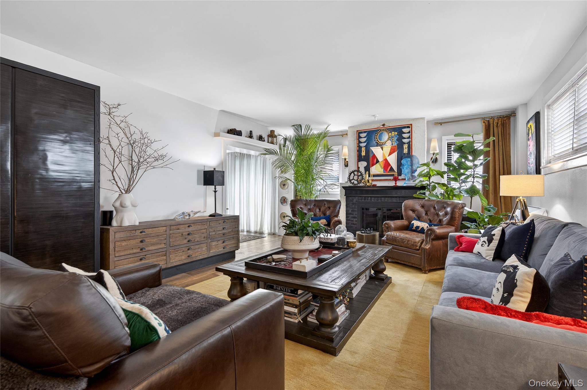 3 Beacon Hill Road Port Washington, NY 11050 - Photo 8 of 43 a living room with furniture fireplace and a large window