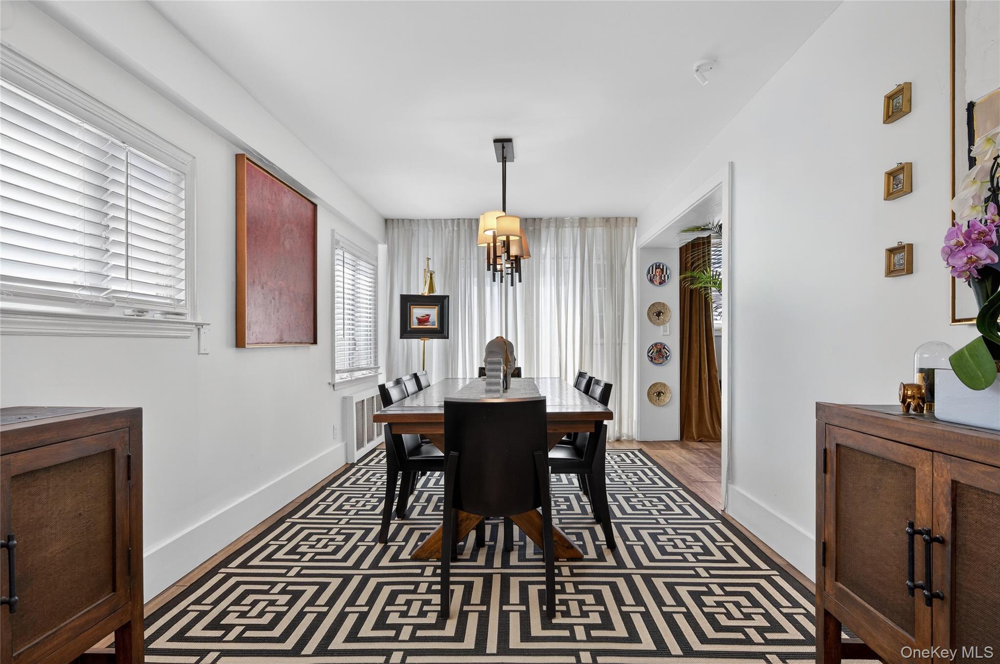 3 Beacon Hill Road Port Washington, NY 11050 - Photo 10 of 43 a view of a dining room with furniture window and wooden floor