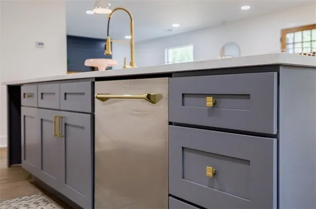 a kitchen with a refrigerator and cabinets