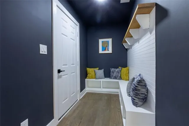 a view of hallway with stairs and a couch