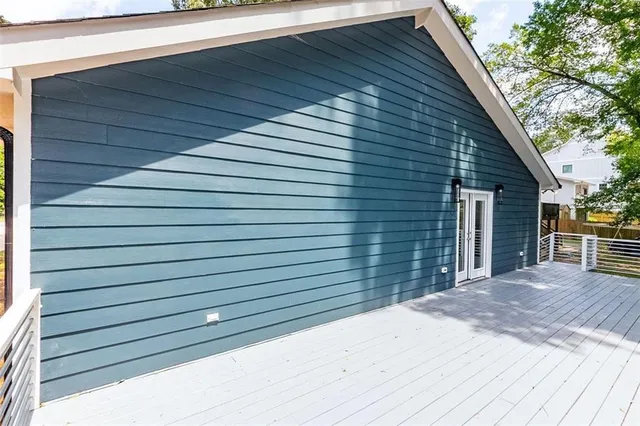 a view of backyard with a deck