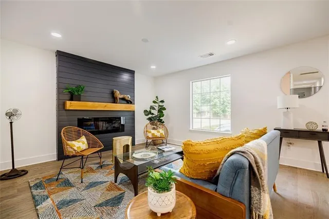 a bedroom with furniture and a fireplace