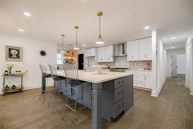 a kitchen with a sink a center island a counter space and a center island