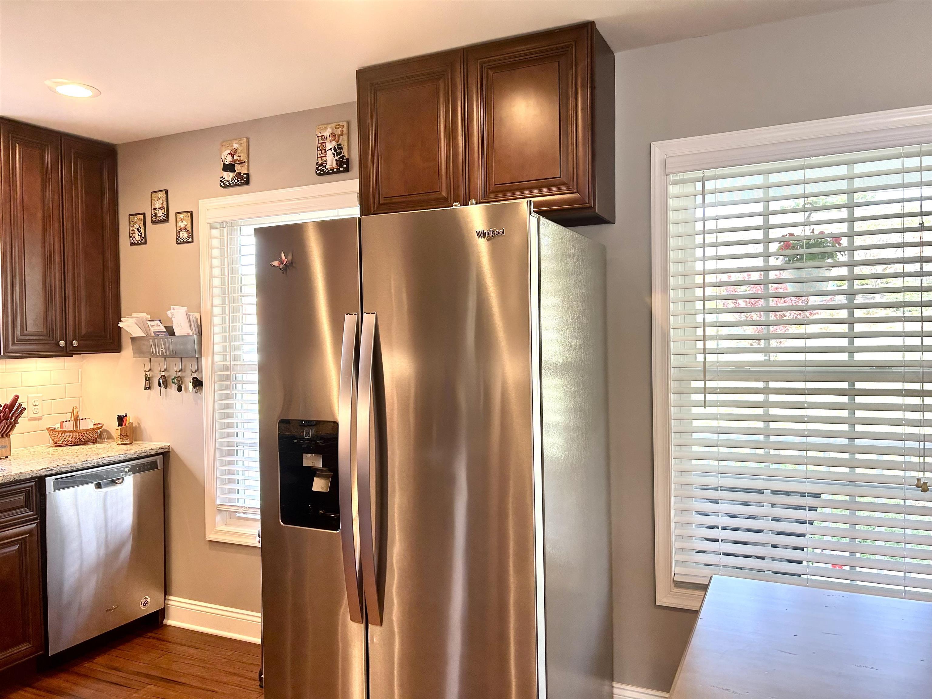7 Rolla Mill Road Verona, VA 24482 - Photo 12 of 59 a metallic refrigerator freezer sitting inside of a kitchen