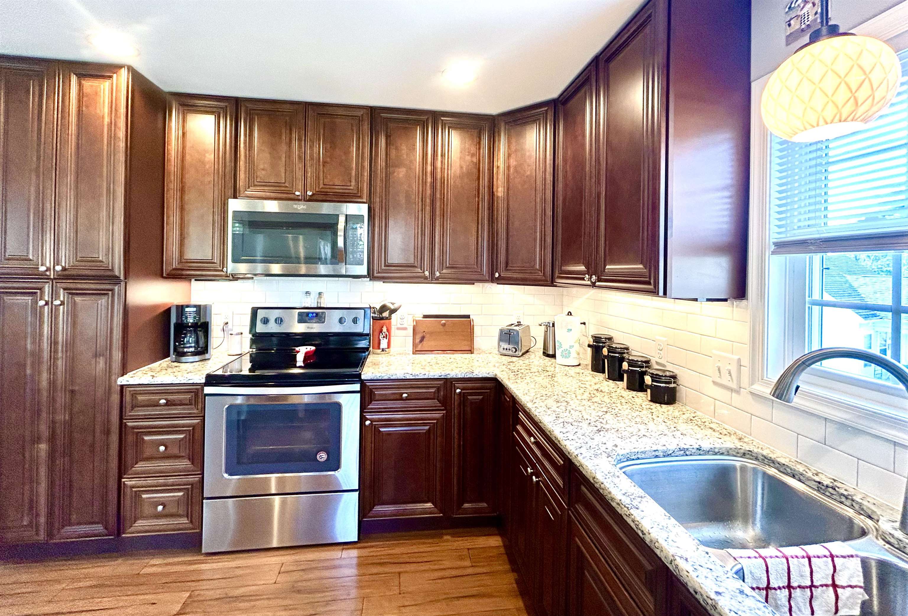 7 Rolla Mill Road Verona, VA 24482 - Photo 13 of 59 a kitchen with kitchen island granite countertop wooden cabinets a stove top oven a sink and dishwasher