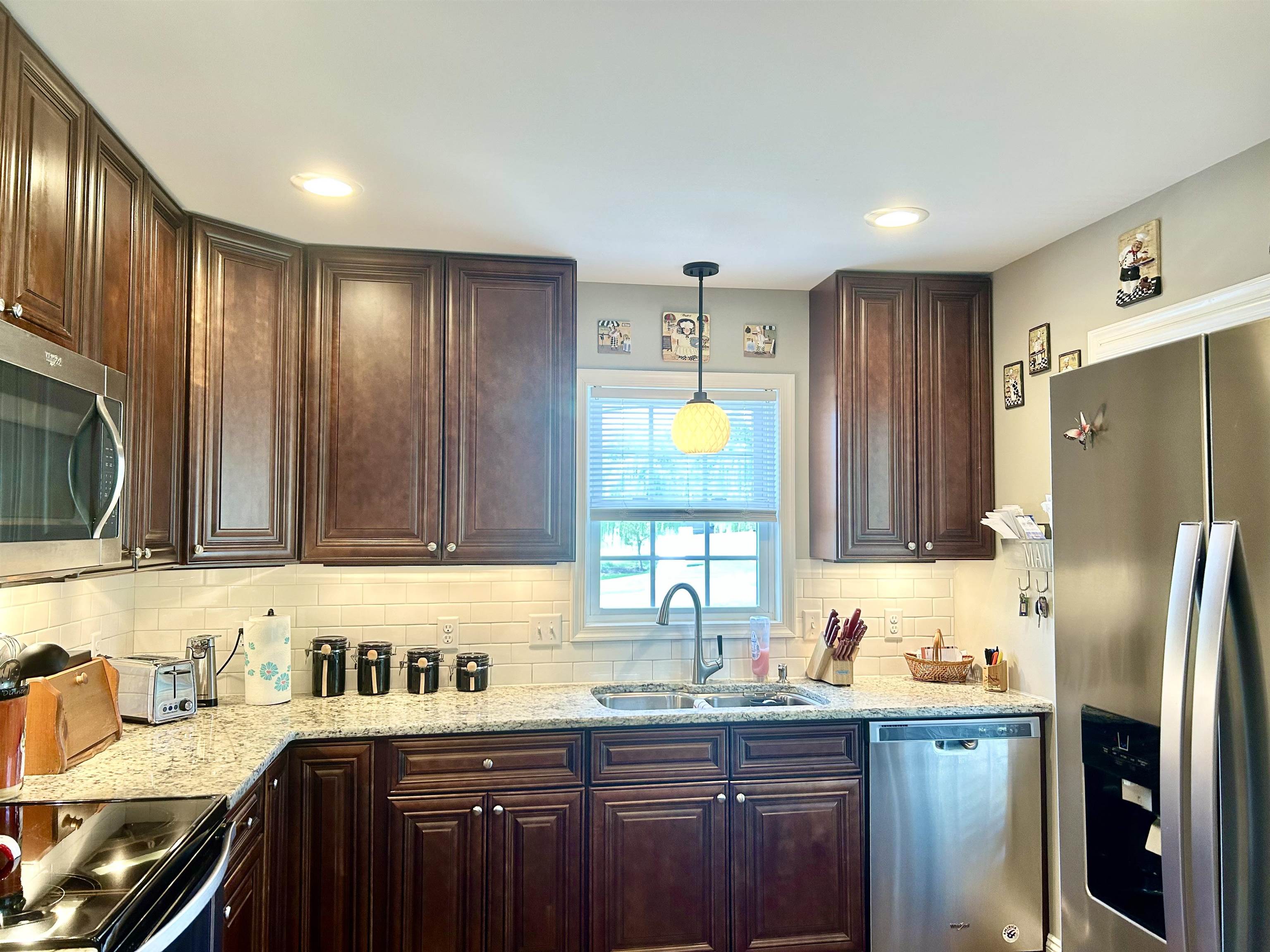 7 Rolla Mill Road Verona, VA 24482 - Photo 14 of 59 a kitchen with stainless steel appliances granite countertop a refrigerator a sink dishwasher and wooden cabinets with a stove