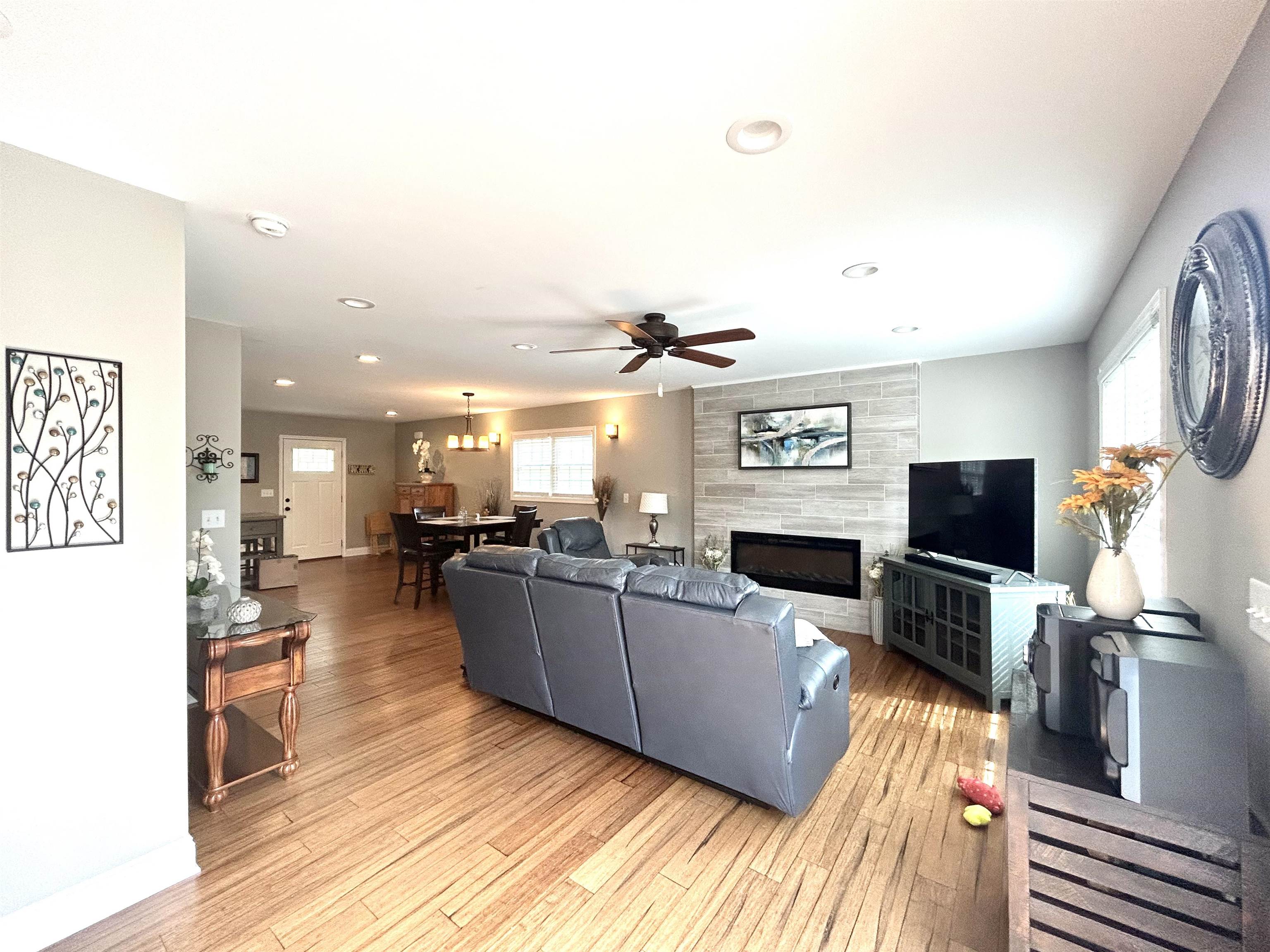 7 Rolla Mill Road Verona, VA 24482 - Photo 20 of 59 a living room with furniture a flat screen tv and a fireplace