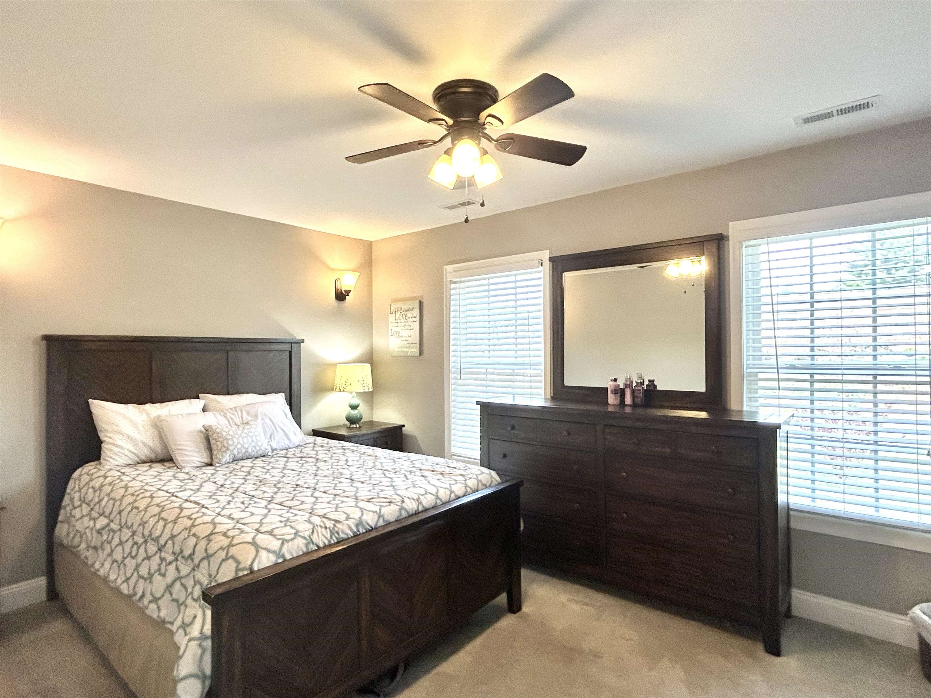 7 Rolla Mill Road Verona, VA 24482 - Photo 24 of 59 a bedroom with a bed and a chandelier