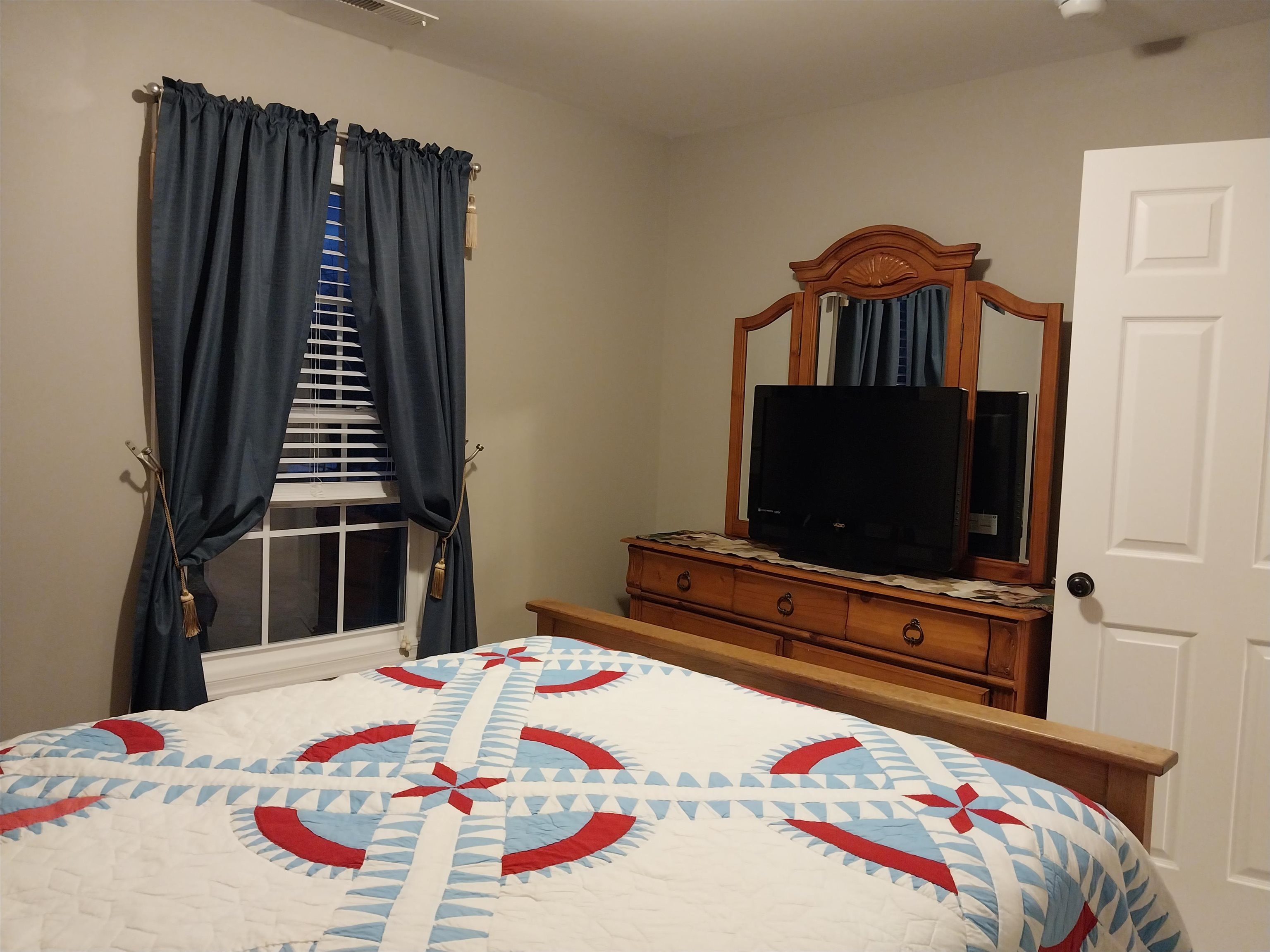 7 Rolla Mill Road Verona, VA 24482 - Photo 31 of 59 a bedroom with a bed and a flat screen tv
