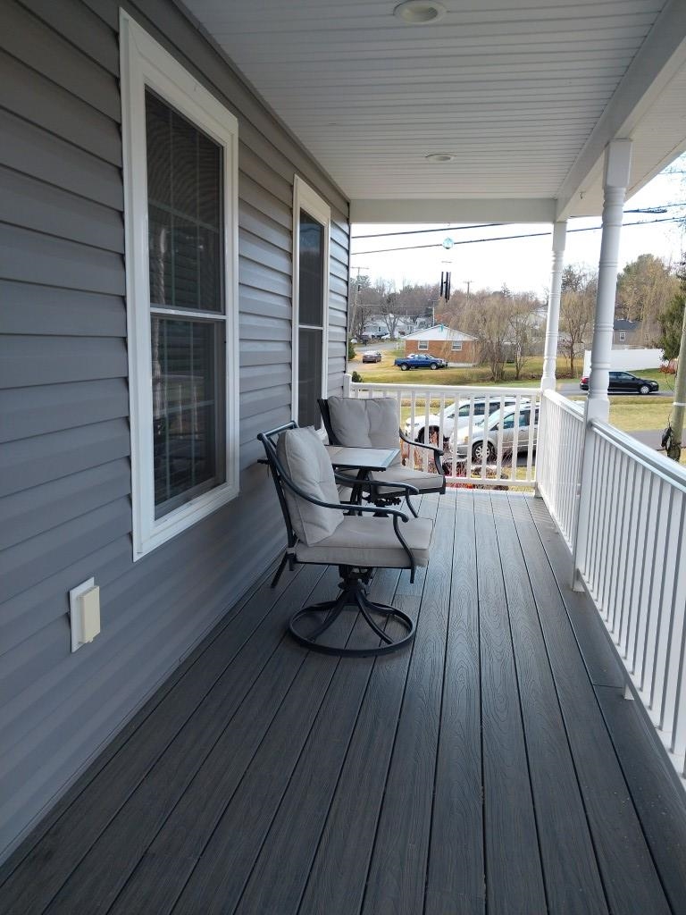 7 Rolla Mill Road Verona, VA 24482 - Photo 8 of 59 a view of a balcony with chair and wooden floor