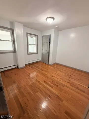 a bathroom with a toilet a sink and a window