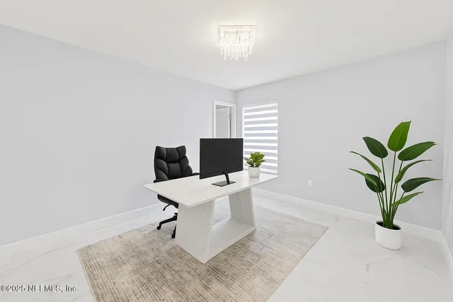 a view of staircase with white walls and white door