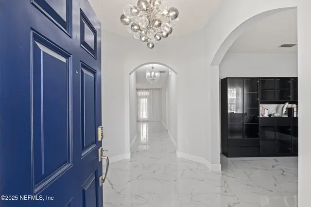 a view of entryway with chandelier