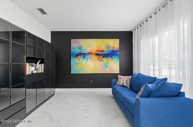 a view of a hallway with chandelier