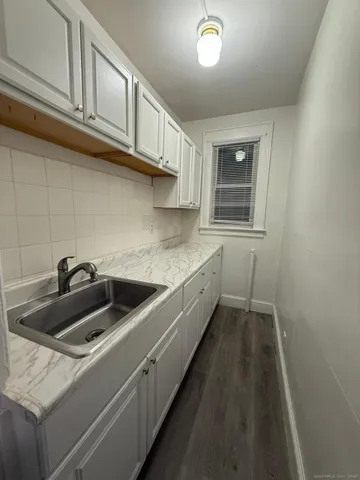a kitchen with a sink and cabinets