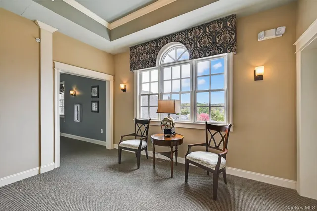 a dining room with furniture and a window