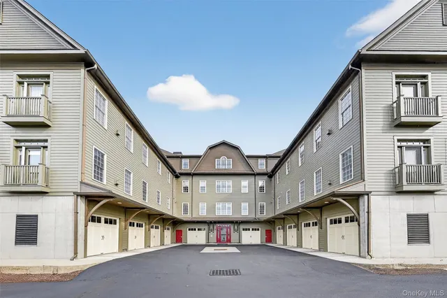 a view of a large building with a small yard