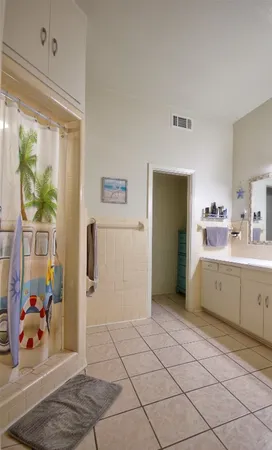 a bathroom with a sink mirror and toilet