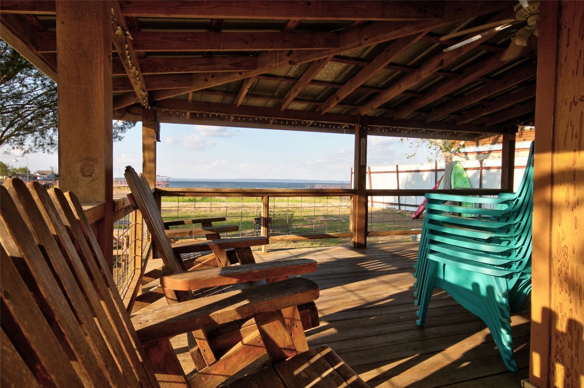 1504 Ranch Road 261 Buchanan Dam, TX 78609 - Photo 24 of 40 a view of a patio with a table chairs and a backyard