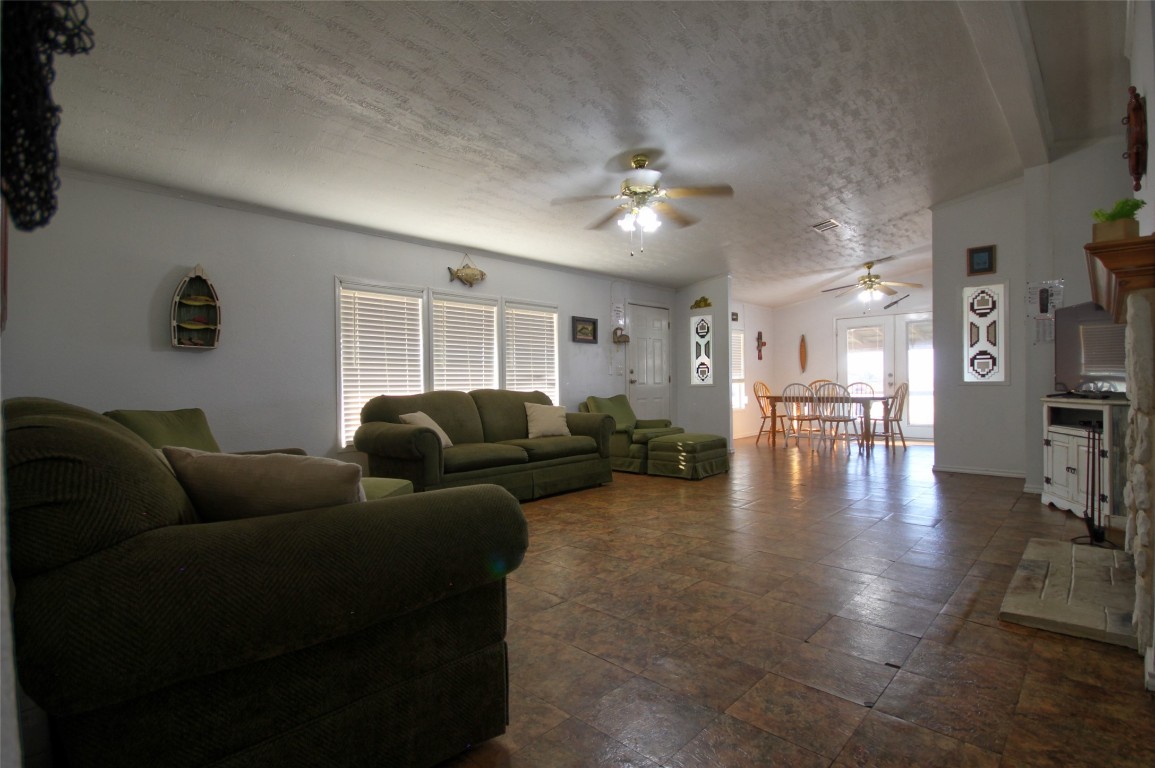 1504 Ranch Road 261 Buchanan Dam, TX 78609 - Photo 26 of 40 a living room with furniture and a wooden floor
