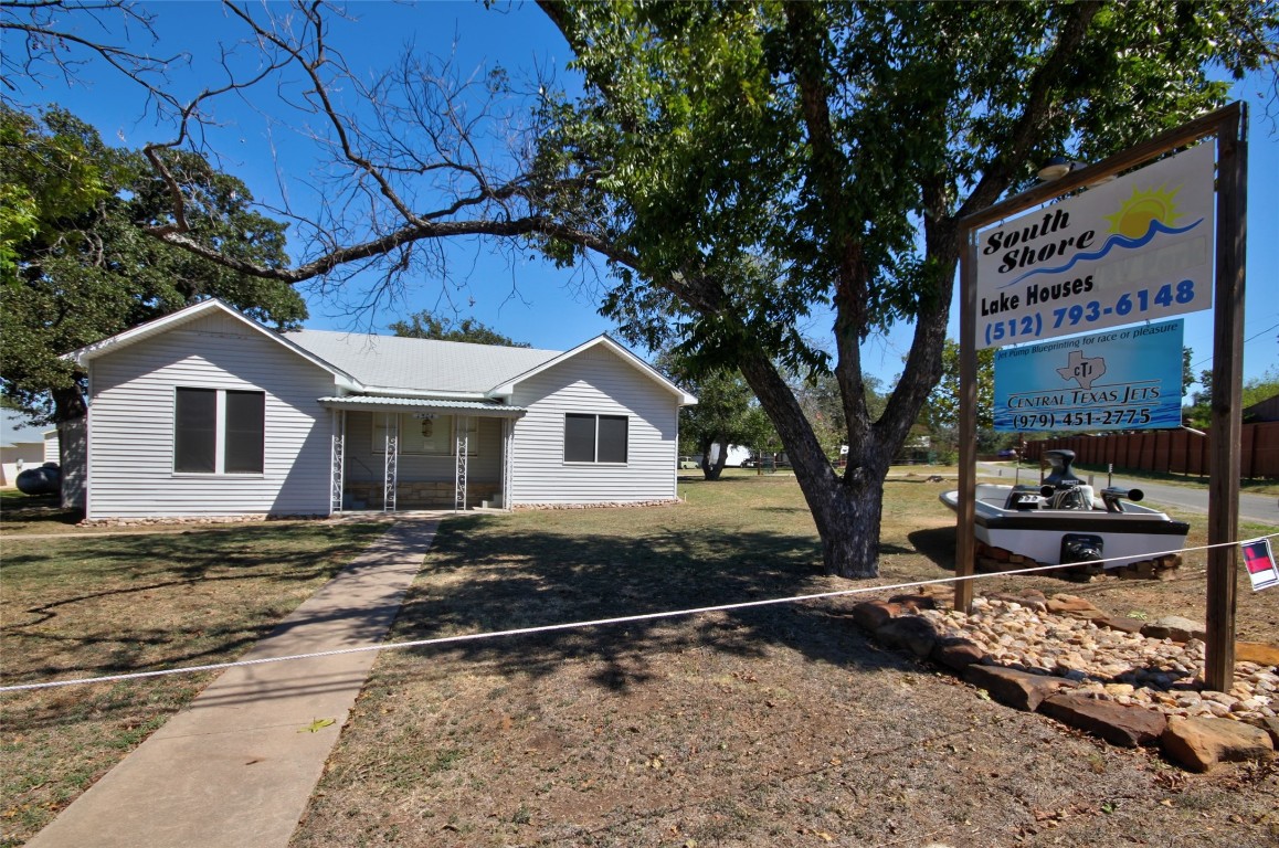 1504 Ranch Road 261 Buchanan Dam, TX 78609 - Photo 3 of 40 a white house with tree in the background