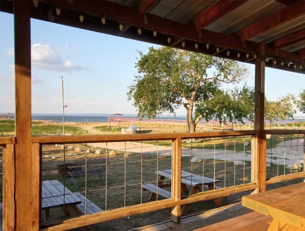 a bedroom with a bed and a night stand