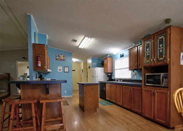 a kitchen with a sink cabinets and window