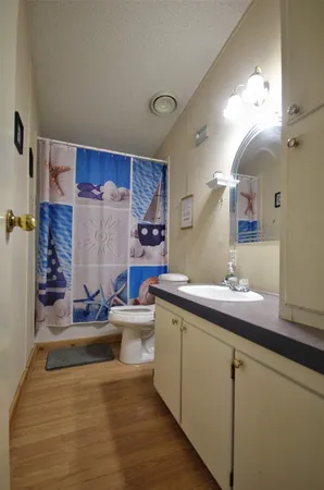 a view of a house with a snow in the background