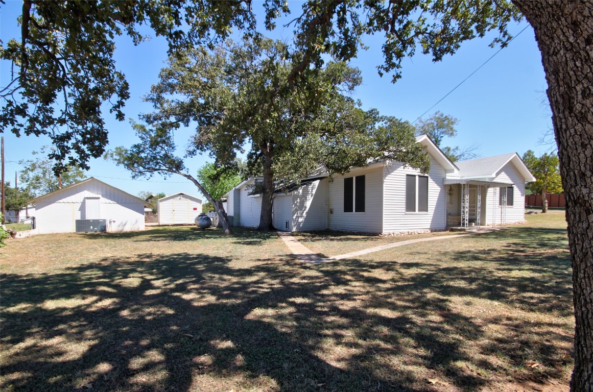 1504 Ranch Road 261 Buchanan Dam, TX 78609 - Photo 6 of 40 a front view of a house with a yard