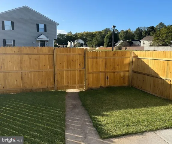 a view of a lake with a yard