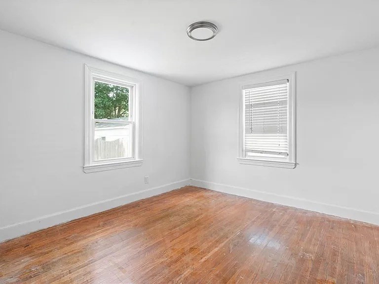 85 Manistee Street Pawtucket, RI 02861 - Photo 6 of 12 an empty room with a window