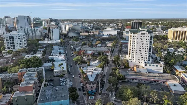 a bedroom with a bed couch and a window