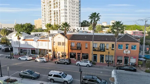 a aerial view of a house with a garden and pathway