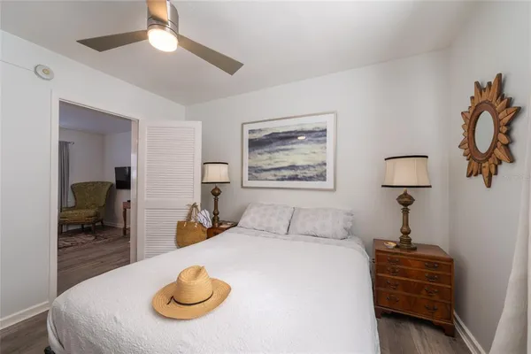 a bathroom with a granite countertop sink mirror vanity and toilet