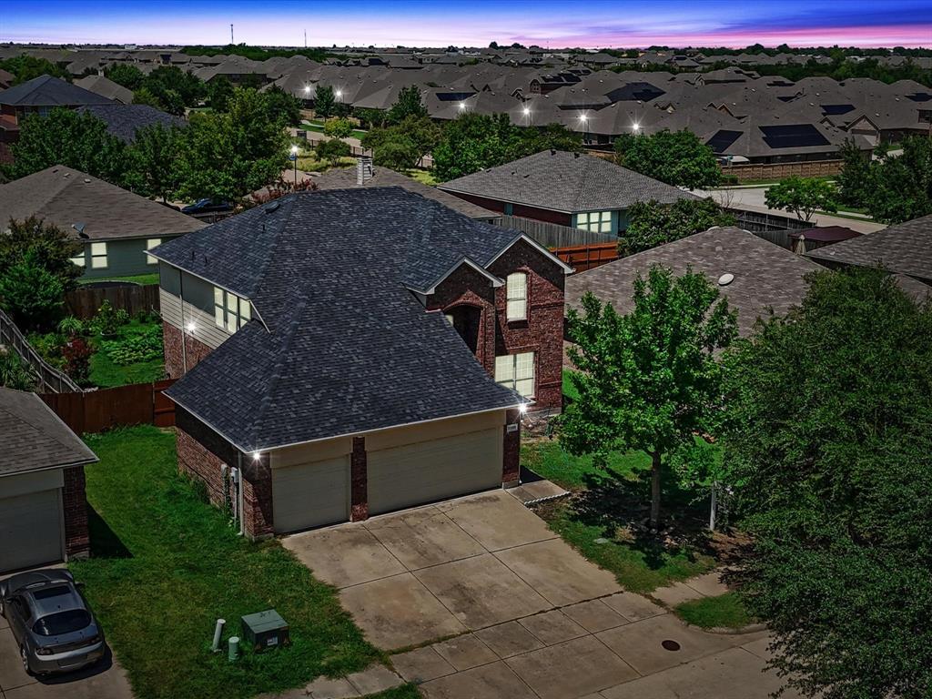 2009 Cooper Ridge Lane Heartland, TX 75126 - Photo 2 of 40 an aerial view of multiple houses with a yard