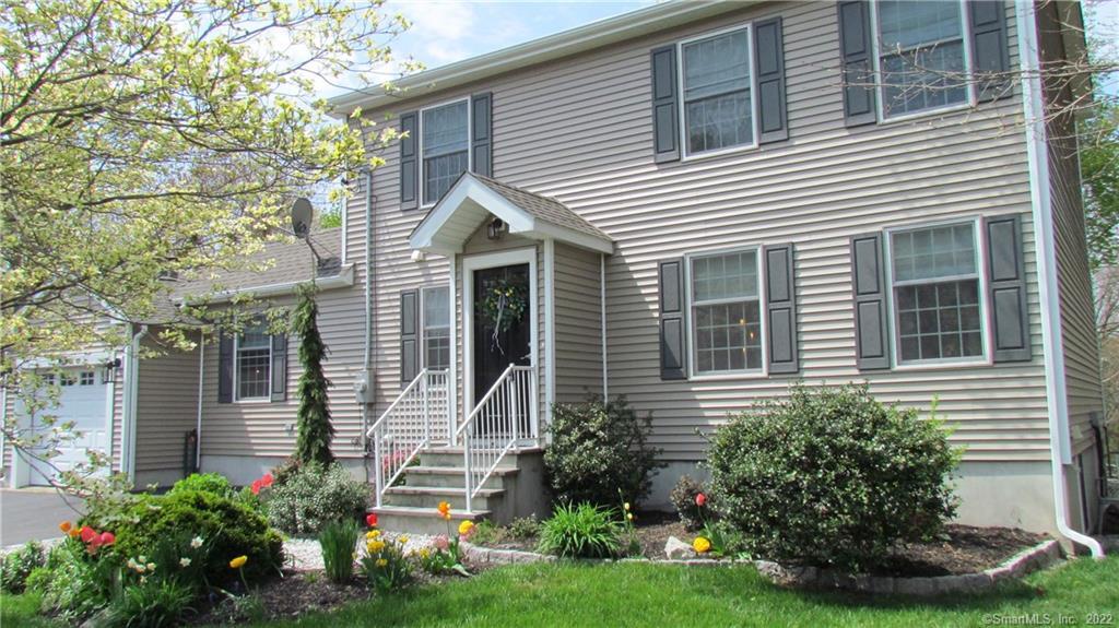 250 Roses Mill Road Milford, CT 06460 - Photo 1 of 1 a front view of a house with a garden