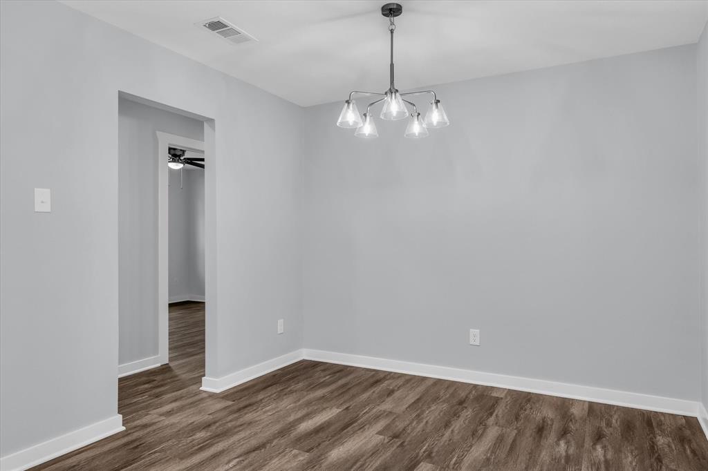 3608 North 26th Street Waco, TX 76708 - Photo 7 of 28 a view of an empty room with wooden floor