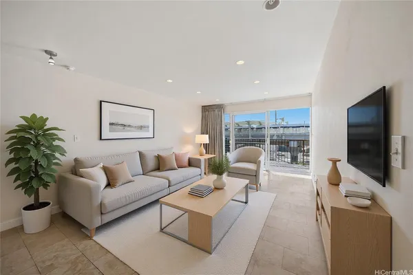a living room with furniture and a flat screen tv