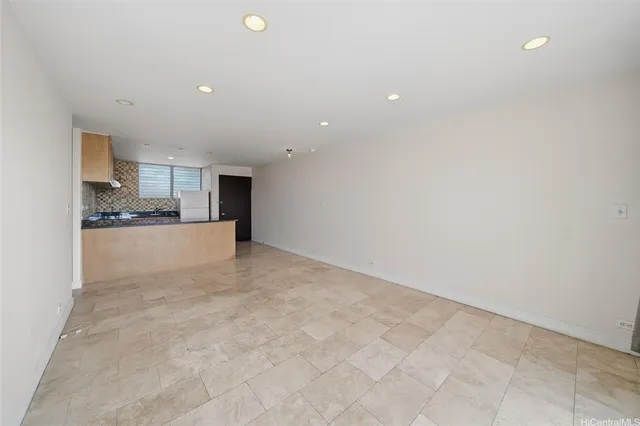 a view of a kitchen with a sink and a refrigerator