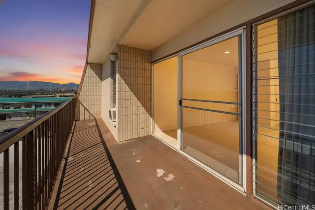 a view of balcony with wooden floor