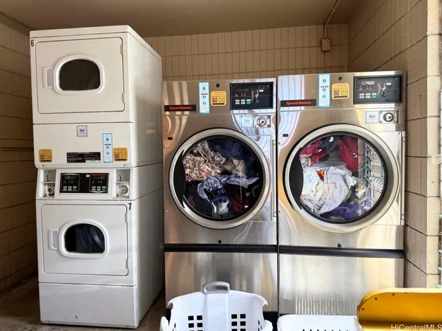 a view of staircase with wooden floor and white walls
