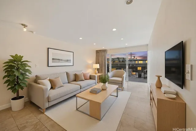 a living room with furniture and a flat screen tv