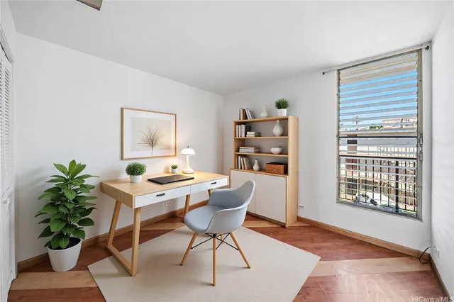 a workspace with furniture and a potted plant