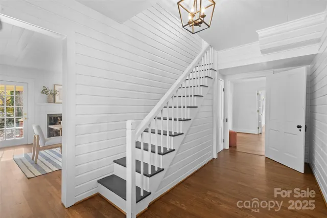 a view of an entryway with wooden floor